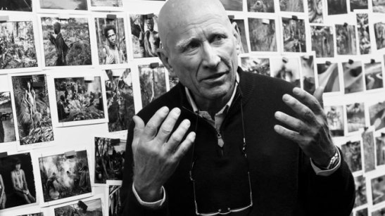 Sebastiao Salgado surrounded by his images in The Salt of the Earth. 