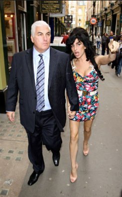 Winehouse with her father Mitch in London.