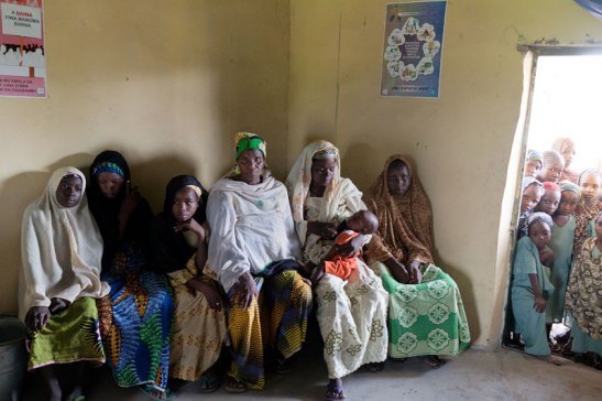 Women and girls wait at a clinic in rural Nigeria. Image (c) Mark Tuschman