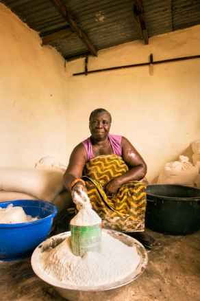 Microfinance loans have helped women like Ghanaian Evelyn Quartey, who is now a distributor of flour. Image (c) Mark Tuschman