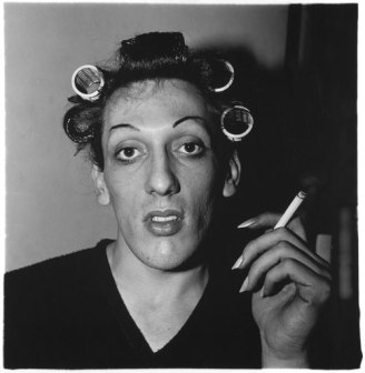 A young man in curlers at home on West 20th Street, N.Y.C, 1966, (c) Diane Arbus